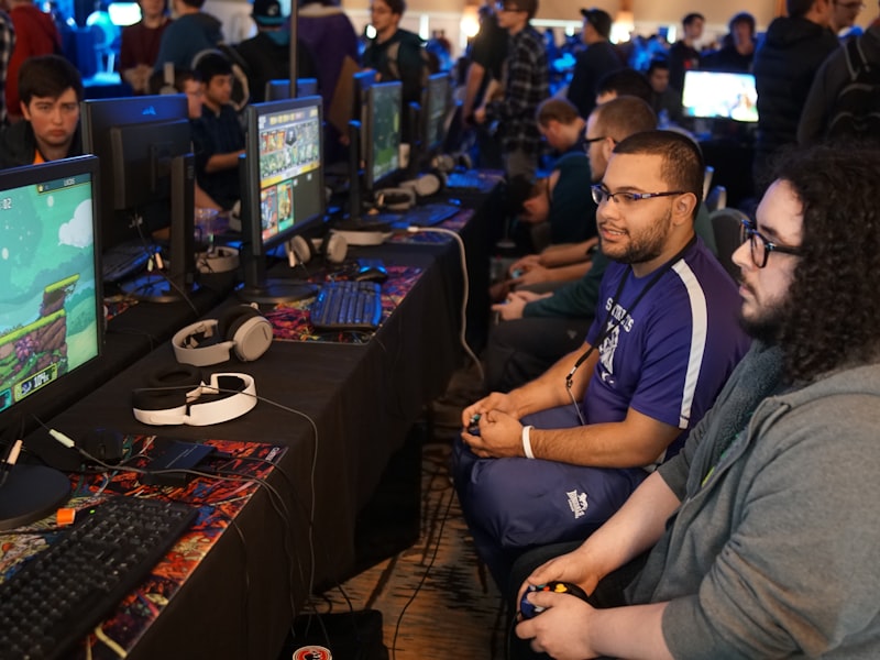 Players competing at a MysticBattleOutpost tournament station